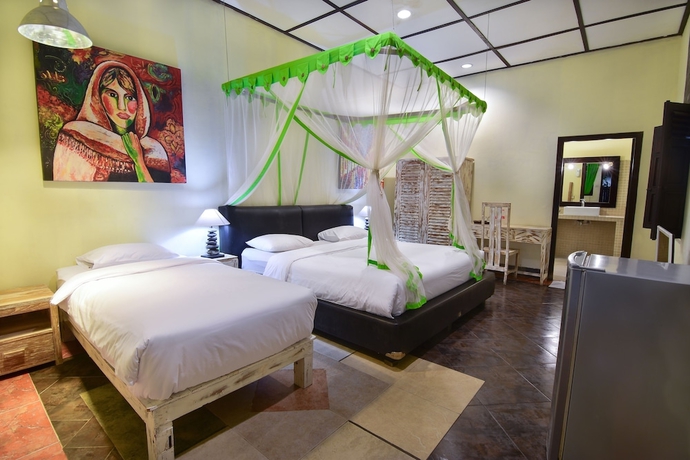 Imagen de la habitación del Hotel Tigalima Homestay. Foto 12