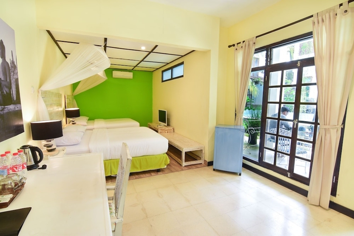Imagen de la habitación del Hotel Tigalima Homestay. Foto 13