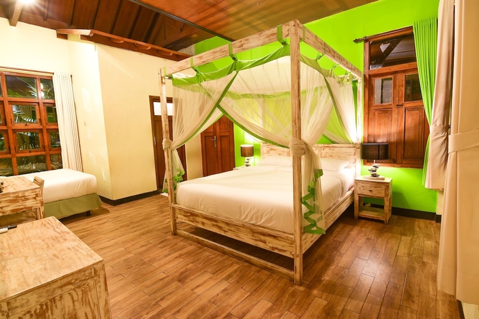 Imagen de la habitación del Hotel Tigalima Homestay. Foto 15