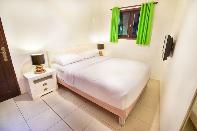 Imagen de la habitación del Hotel Tigalima Homestay. Foto 17