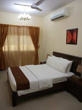 Imagen de la habitación del Hotel Tiger Home Apartment. Foto 11