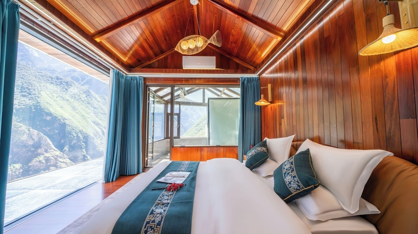 Imagen de la habitación del Hotel Tiger Leaping Gorge yachajiao Manor. Foto 11