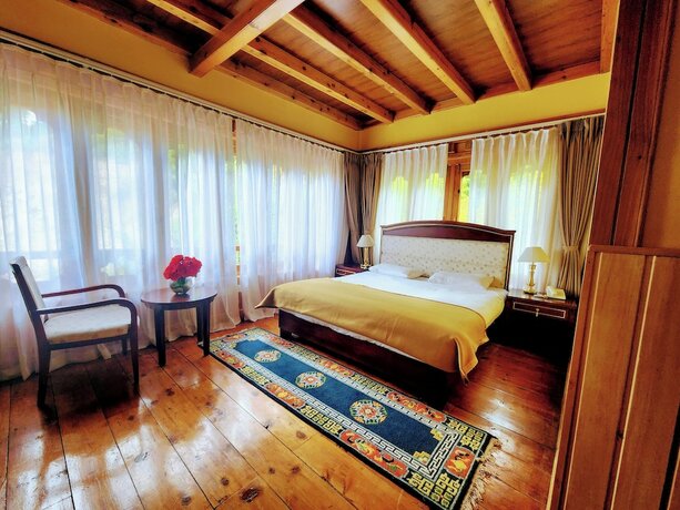 Imagen de la habitación del Hotel Tiger Nest Resort. Foto 17