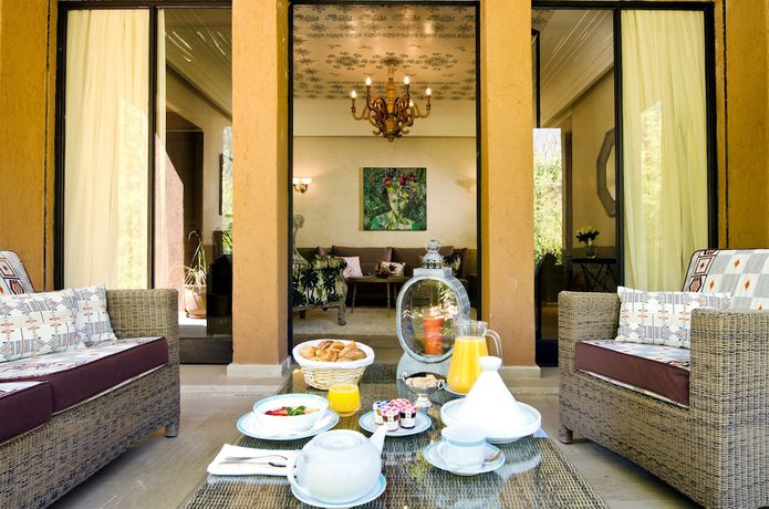 Imagen de la habitación del Hotel Tigmiza Suites and Pavillions. Foto 17