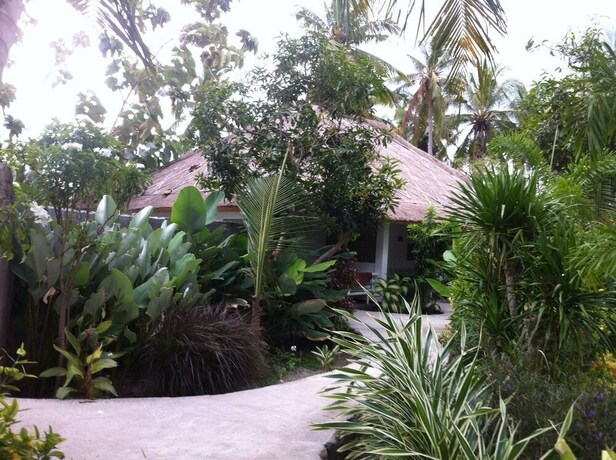 Imagen de la habitación del Hotel Tiki Lodge Lombok. Foto 20