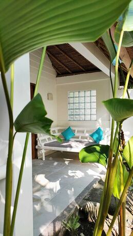 Imagen de la habitación del Hotel Tiki Lodge Lombok. Foto 21