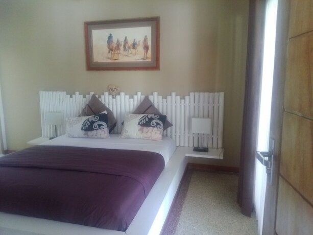 Imagen de la habitación del Hotel Tiki Lodge Lombok. Foto 22