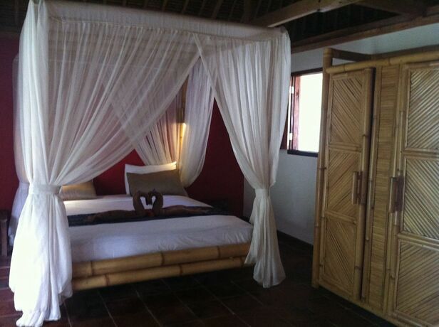 Imagen de la habitación del Hotel Tiki Lodge Lombok. Foto 27