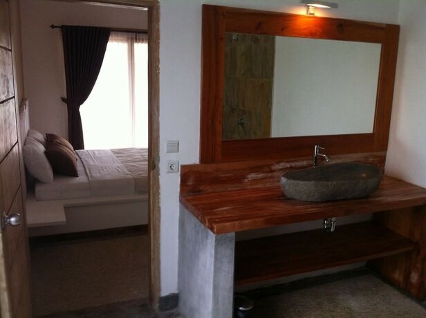 Imagen de la habitación del Hotel Tiki Lodge Lombok. Foto 28