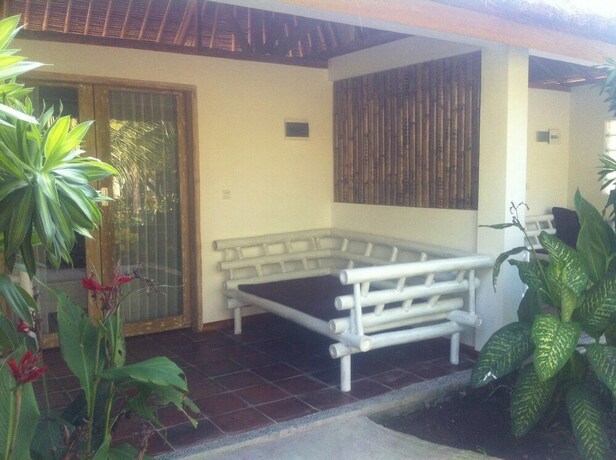 Imagen de la habitación del Hotel Tiki Lodge Lombok. Foto 30