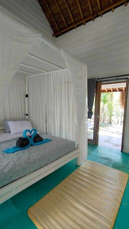 Imagen de la habitación del Hotel Tiki Lodge Lombok. Foto 33