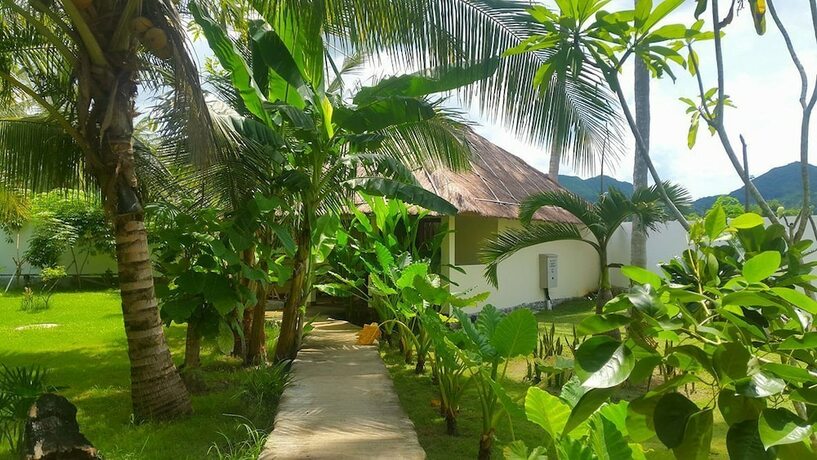 Imagen de la habitación del Hotel Tiki Lodge Lombok. Foto 35