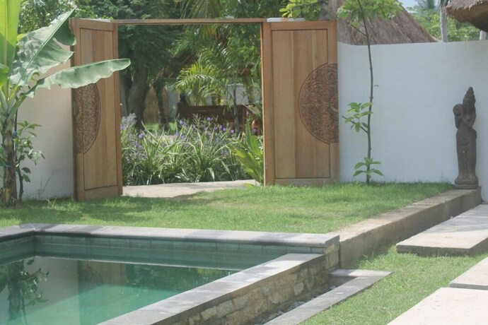 Imagen de la habitación del Hotel Tiki Lodge Lombok. Foto 37