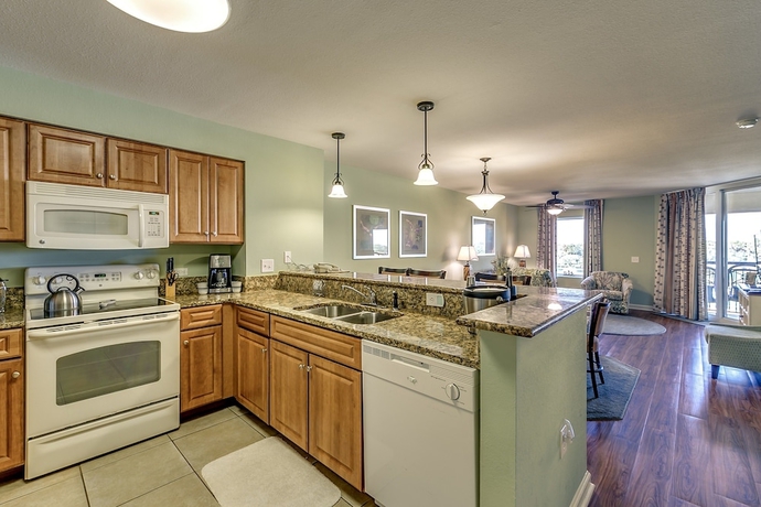 Imagen de la habitación del Hotel Tilghman Beach and Golf Resort by Condo-World. Foto 11