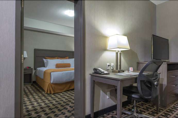 Imagen de la habitación del Hotel Timber Ridge Inn And Suites. Foto 12