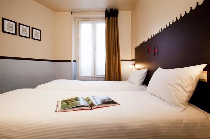 Imagen de la habitación del Hotel Timhotel Paris Gare Du Nord. Foto 8