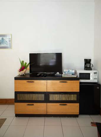 Imagen de la habitación del Hotel Tingum Village. Foto 17