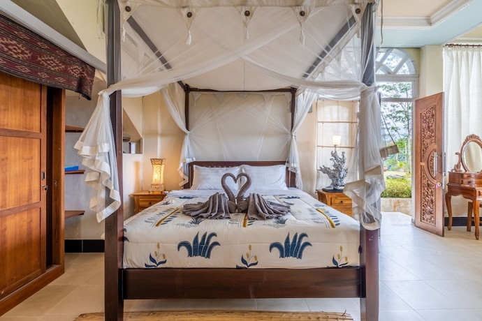 Imagen de la habitación del Hotel Tirta Asri Ubud Villa. Foto 9