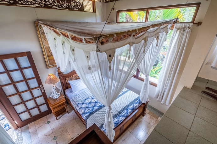 Imagen de la habitación del Hotel Tirta Asri Ubud Villa. Foto 11