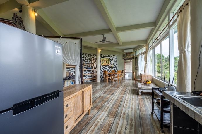 Imagen de la habitación del Hotel Tirta Asri Ubud Villa. Foto 12
