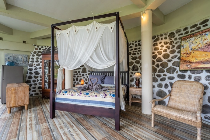 Imagen de la habitación del Hotel Tirta Asri Ubud Villa. Foto 13