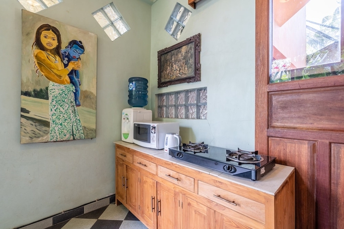 Imagen de la habitación del Hotel Tirta Asri Ubud Villa. Foto 17