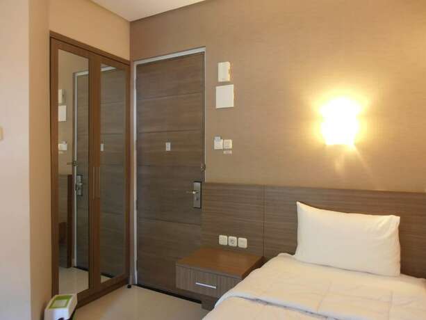 Imagen de la habitación del Hotel Tirta Mansion Premier. Foto 19