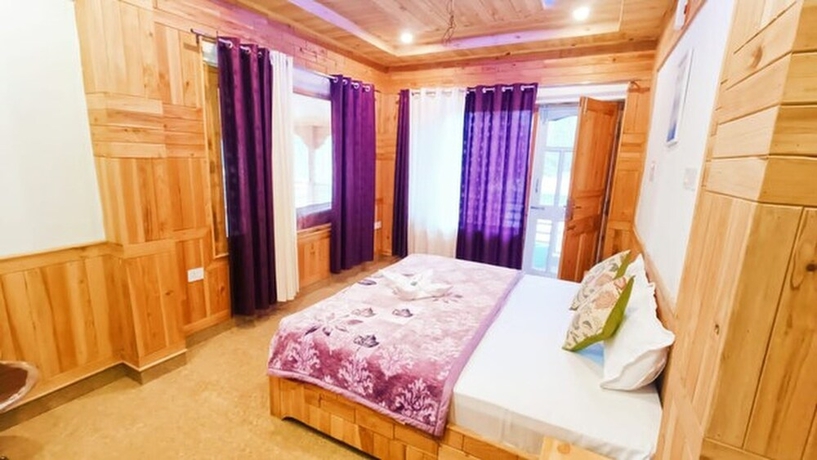 Imagen de la habitación del Hotel Tirthan Brij Edge. Foto 8