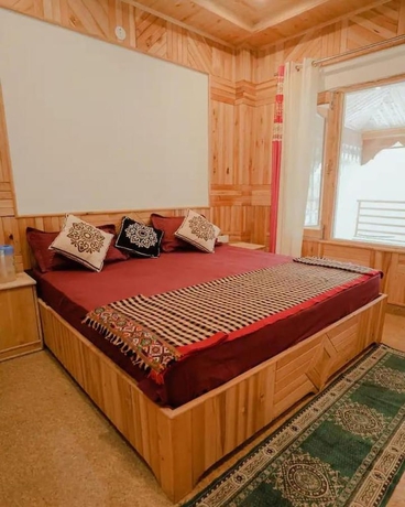 Imagen de la habitación del Hotel Tirthan Brij Edge. Foto 10
