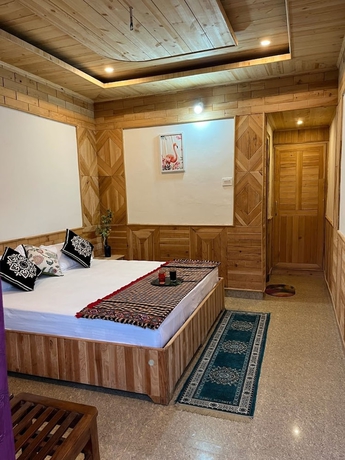 Imagen de la habitación del Hotel Tirthan Brij Edge. Foto 11