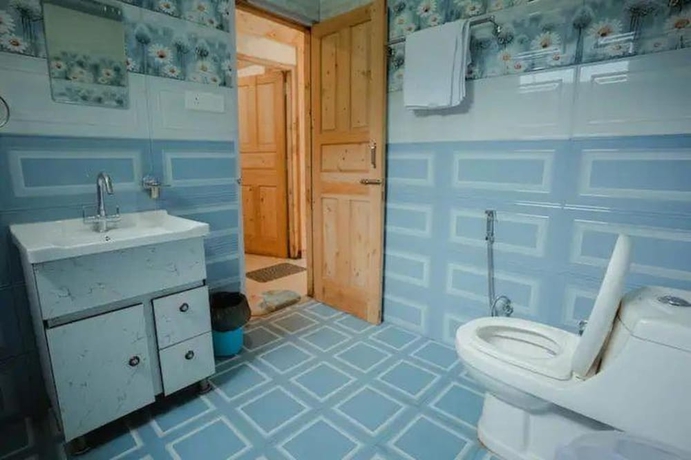 Imagen de la habitación del Hotel Tirthan Brij Edge. Foto 14