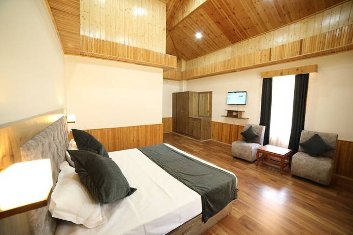 Imagen de la habitación del Hotel Tirthan Villa and Resort. Foto 1