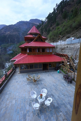 Imagen de la habitación del Hotel Tirthan Village Resort. Foto 2