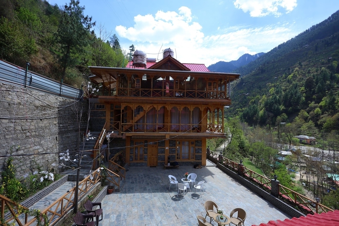 Imagen de la habitación del Hotel Tirthan Village Resort. Foto 10