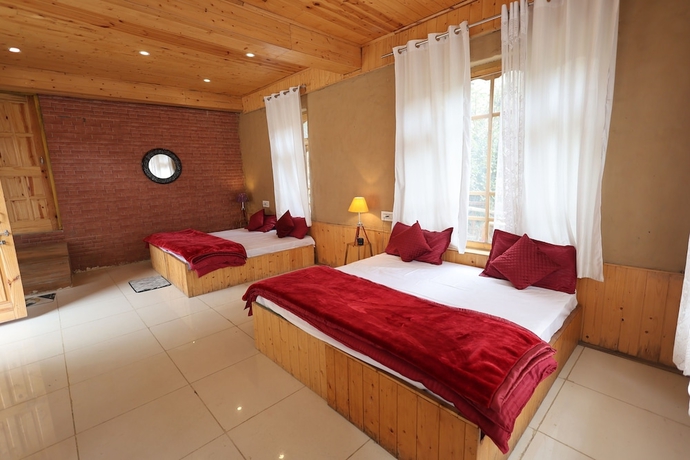 Imagen de la habitación del Hotel Tirthan Village Resort. Foto 13