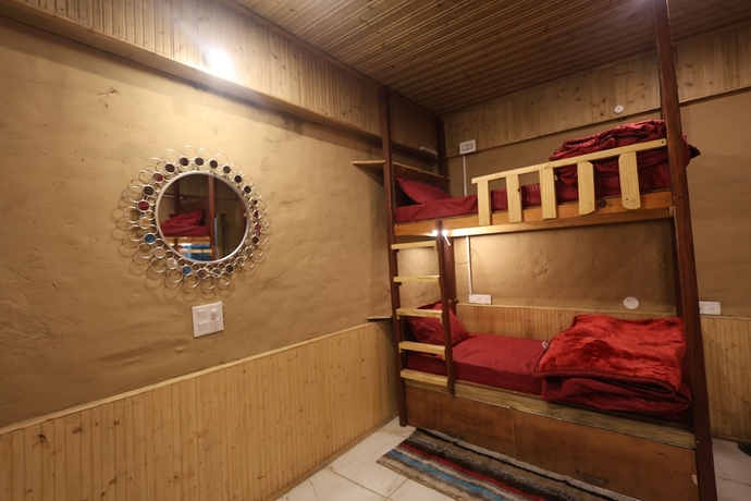 Imagen de la habitación del Hotel Tirthan Village Resort. Foto 14
