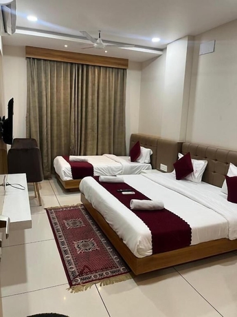 Imagen de la habitación del Hotel Tirupati Inn. Foto 11