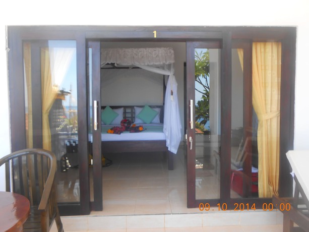 Imagen de la habitación del Hotel Titi Sedana Homestay. Foto 9
