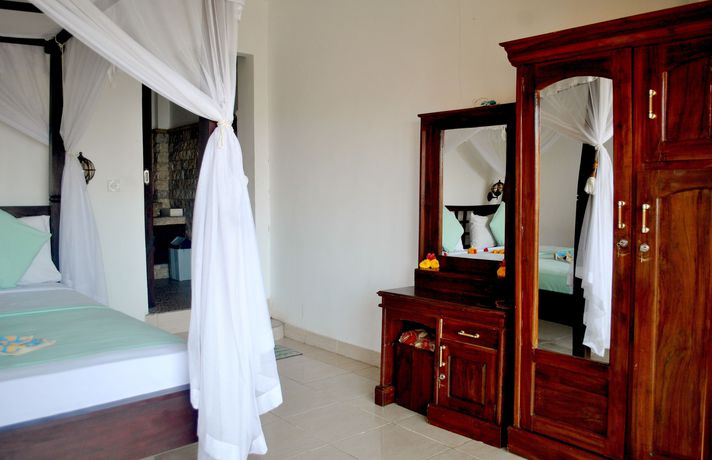 Imagen de la habitación del Hotel Titi Sedana Homestay. Foto 15