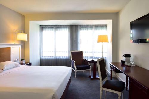 Imagen de la habitación del Hotel Tivoli Coimbra Hotel. Foto 15