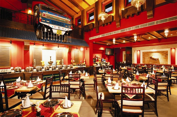 Imagen del bar/restaurante del Hotel Tivoli Garden Resort. Foto 1
