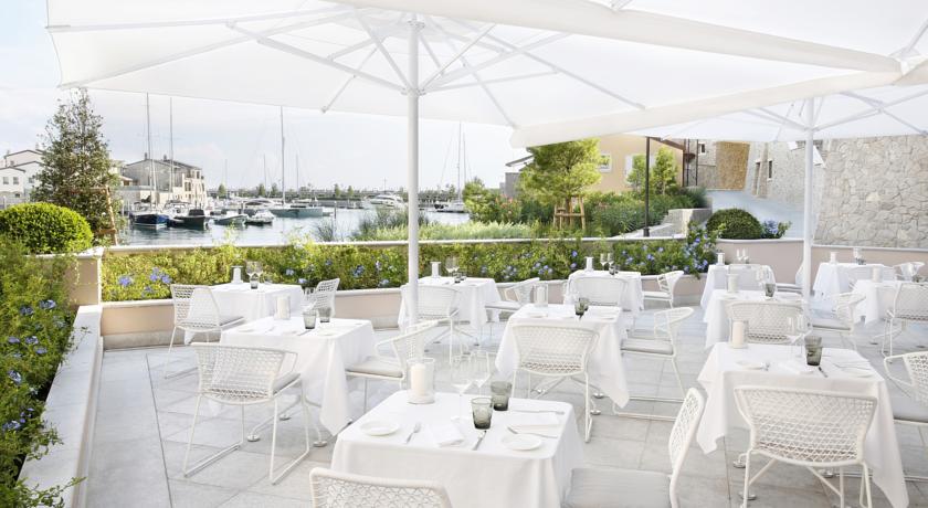 Imagen del bar/restaurante del Hotel Tivoli Portopiccolo Sistiana Wellness Resort and Spa. Foto 3