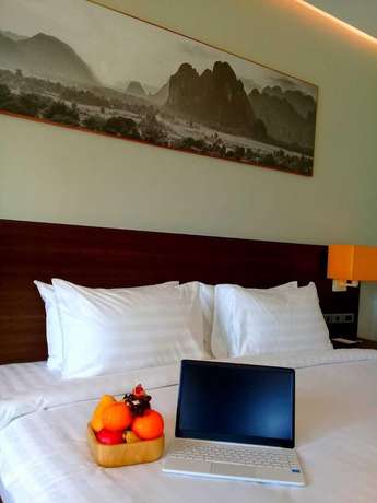 Imagen de la habitación del Hotel Tmark Resort Vang Vieng. Foto 17