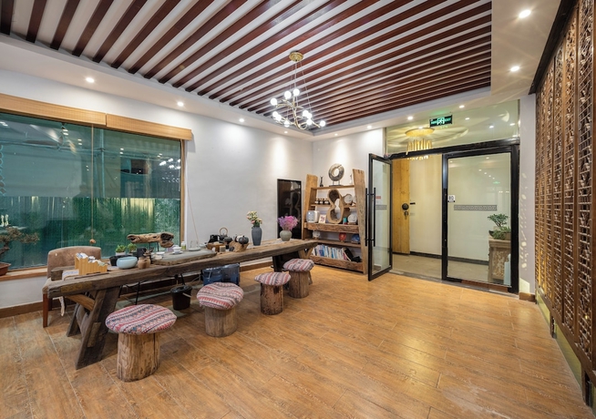 Imagen de los interiores del Hotel Togruo Ge Qi Shi Inn. Foto 11