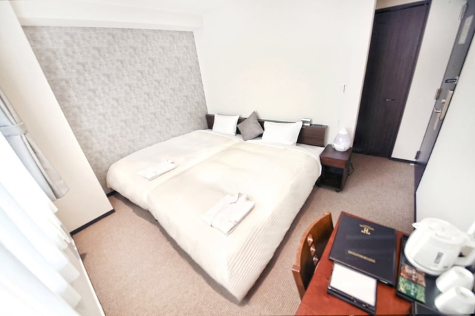 Imagen de la habitación del Hotel Toho. Foto 8