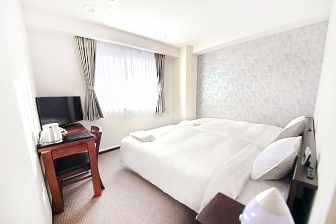 Imagen de la habitación del Hotel Toho. Foto 14