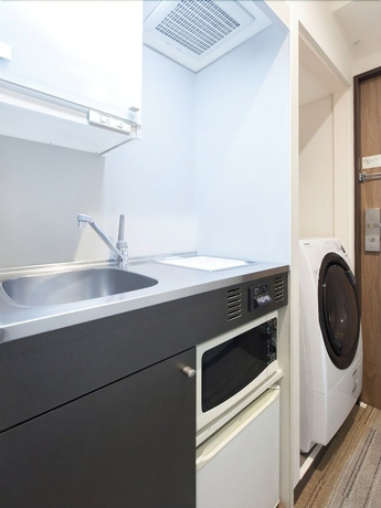 Imagen de la habitación del Hotel Tokyu Stay Yoga. Foto 10