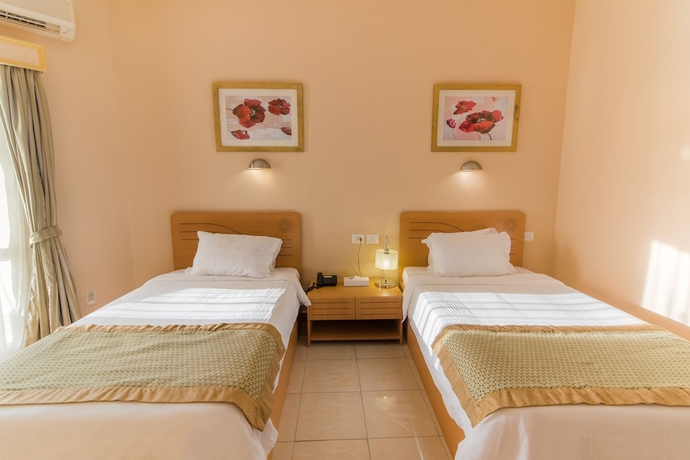 Imagen de la habitación del Hotel Tolip Family Club Borg El Arab. Foto 9
