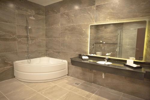 Imagen de la habitación del Hotel Tolip Olympic International City. Foto 14