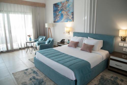 Imagen de la habitación del Hotel Tolip Olympic International City. Foto 17